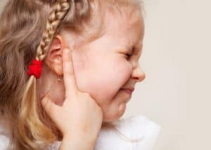 child suffering ear infections